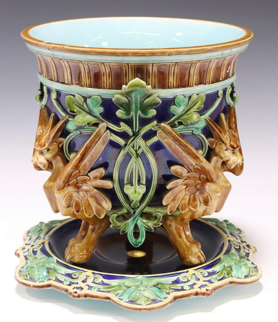 FRENCH SARREGUEMINES MAJOLICA JARDINIERE & STAND: French majolica jardiniere and underplate, Sarreguemine, late 19th c., tapered planter with winged griffins, foliate branches, on an associated underplate, both with impressed model number 426, restor