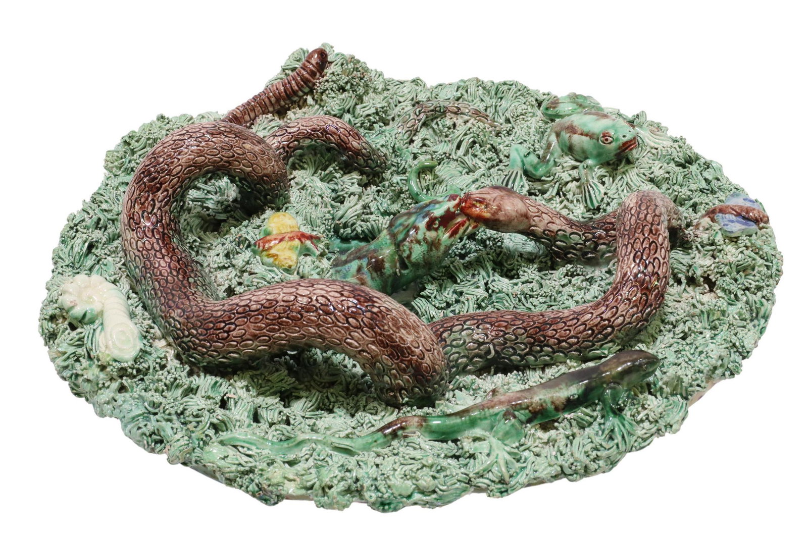 JOSE CUNHA (D.1901) PORTUGESE PALISSY WARE PLATE: Portuguese Palissy ware faience plate, Jose Alves Cunha, (Caldas Rainha, Portugal, 1849-1901), having lizards, serpent, moths, frog, and worms nestled in textured grass, mottled brown glazed underside