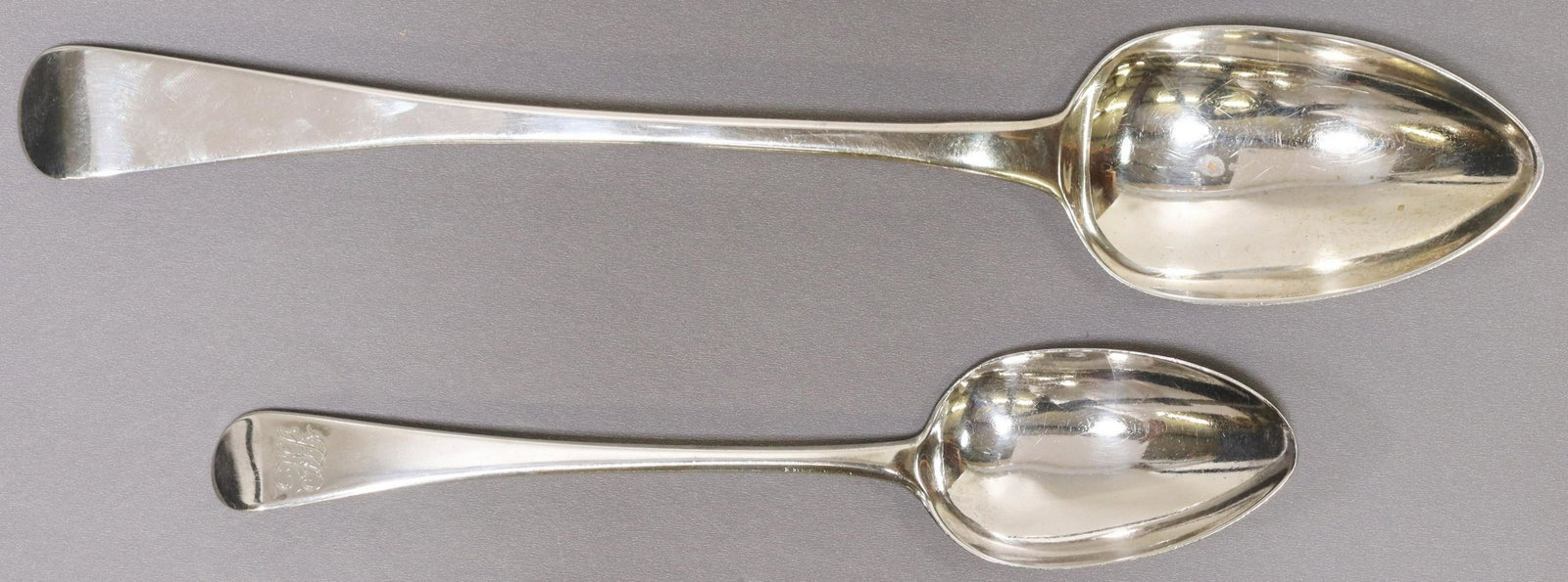 2) ENGLISH GEORGIAN BATEMAN STERLING SERVING SPOON: (lot of 2) English George III sterling silver spoons, both with London hallmarks, including: (1) tablespoon, Peter, Ann, and William Bateman, c.1801, monogrammed, partially obliterated maker's mark, a