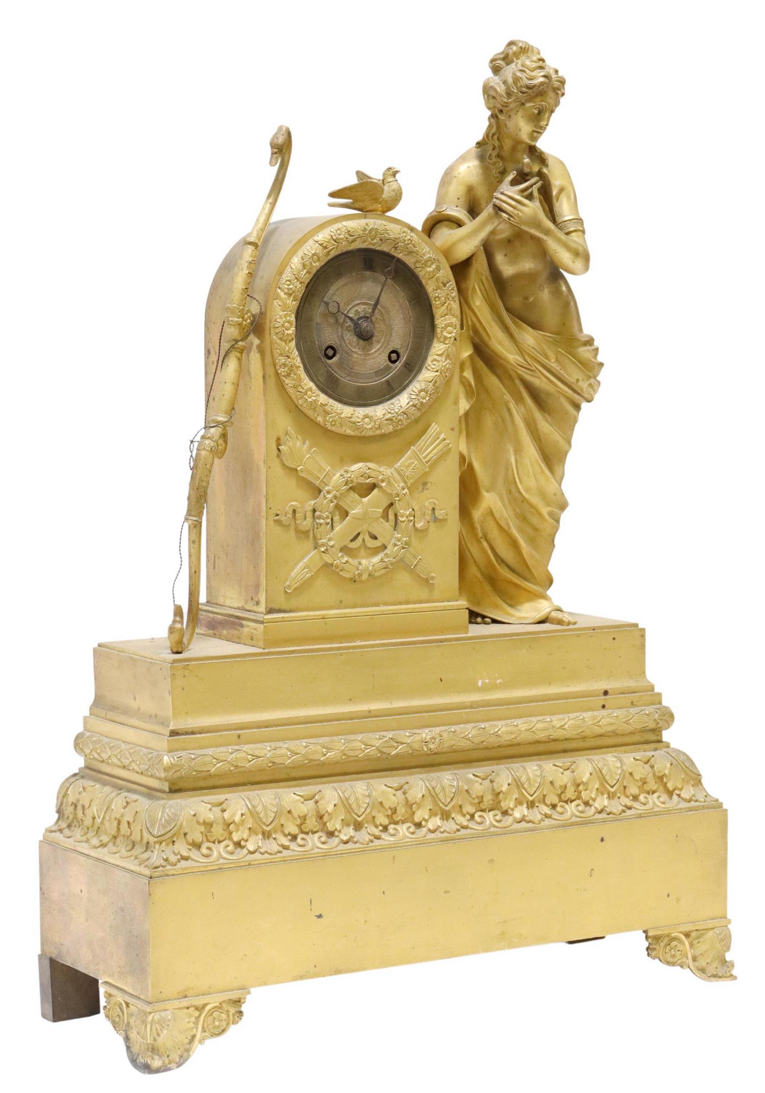 FRENCH RESTAURATION ORMOLU STRIKING MANTEL CLOCK: French Restauration period ormolu mantel shelf clock, first half 19th c., standing figure modeled as Diana with her bow, worn dial with Roman numeral hour markers, time-and-strike movement marked Dauy