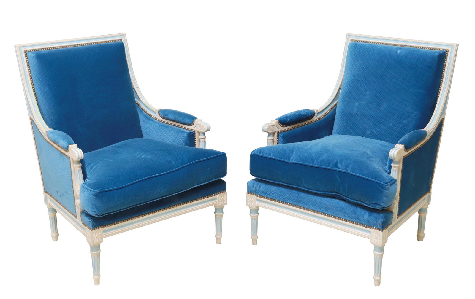 (2) FRENCH LOUIS XVI STYLE BLUE VELVET BERGERES: (pair) French Louis XVI style armchairs, 20th c., having painted wood frame, diamond patterned blue velvet upholstery, removable seat cushions, nailhead trim, rising on fluted tapered legs, ending in 