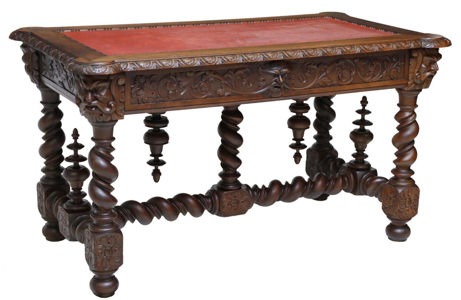 FRENCH LOUIS XIII STYLE CARVED WALNUT BUREAU PLAT: French Louis XIII style walnut writing desk, 19th c., inset top surface, carved apron with projecting masks at the four corners, single frieze drawer, rising on twist legs, joined by H stretcher with 