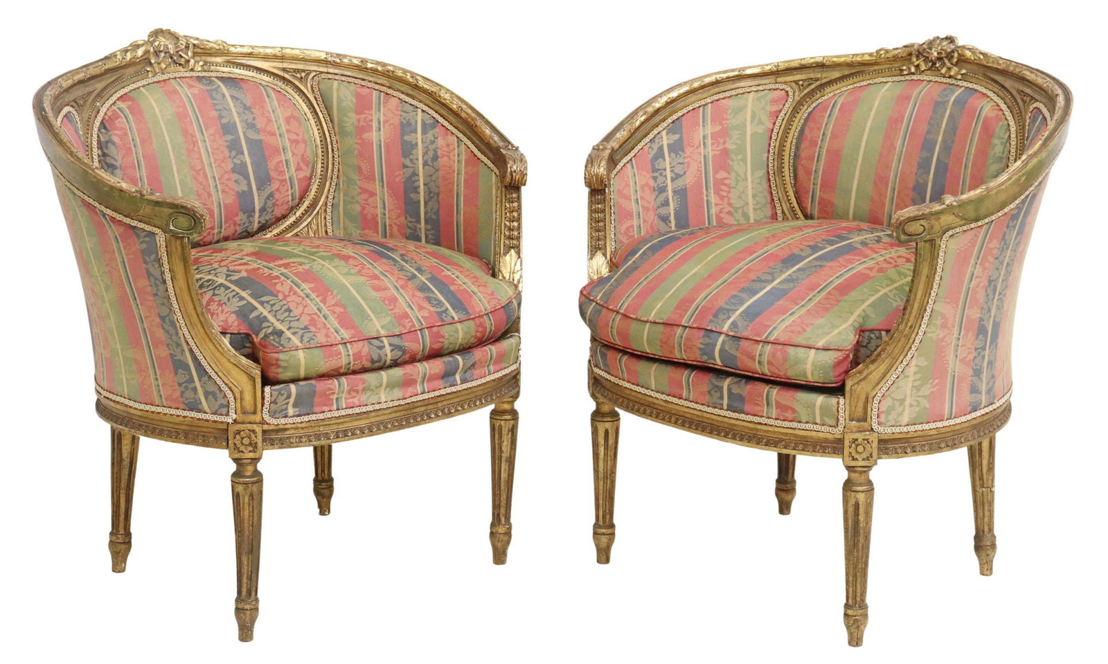 (2) FRENCH LOUIS XVI STYLE GILTWOOD BERGERES: (pair) French Louis XVI style giltwood armchairs, 19th c., having ribbon crest and foliate molding, striped floral upholstery, ribbon trim, removable down-filled seat cushion, rising on fluted tapered