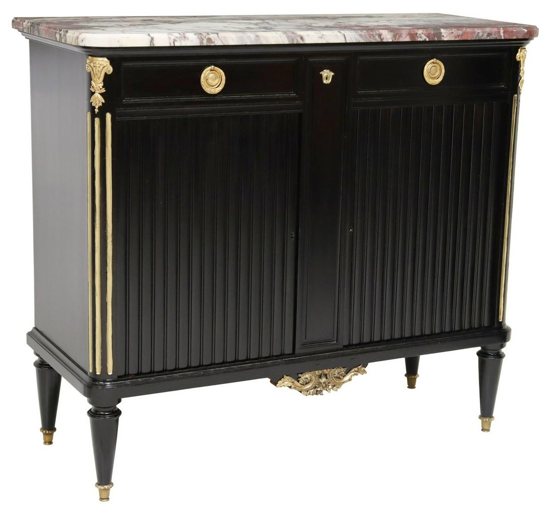 FRENCH LOUIS XVI STYLE MARBLE-TOP SIDEBOARD: French Louis XVI style ebonized sideboard, 20th c., having marble top, over two drawers, reeded front case, dual cabinet doors, opening to shelved interior, with gilt metal mounts, rising on tapered l