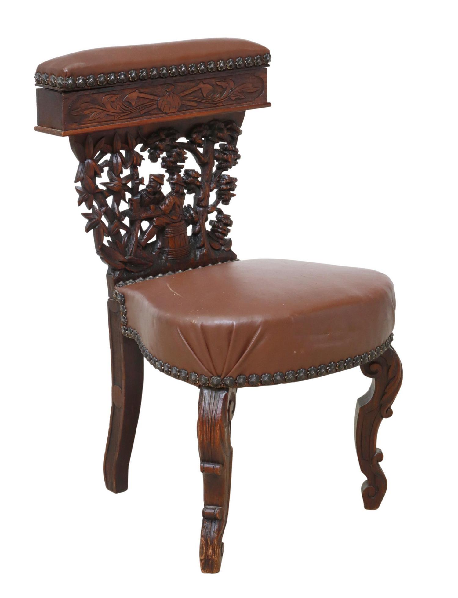 FRENCH FIGURAL CARVED OAK SMOKING CHAIR: French carved oak fumeuse/ smoking chair, late 19th c., hinged top rail, carved splat with tavern scene, upholstered seat, rising on scroll legs, approx 31.5"h, 17.5"w, 17"d, seat height: approx 18"h 
