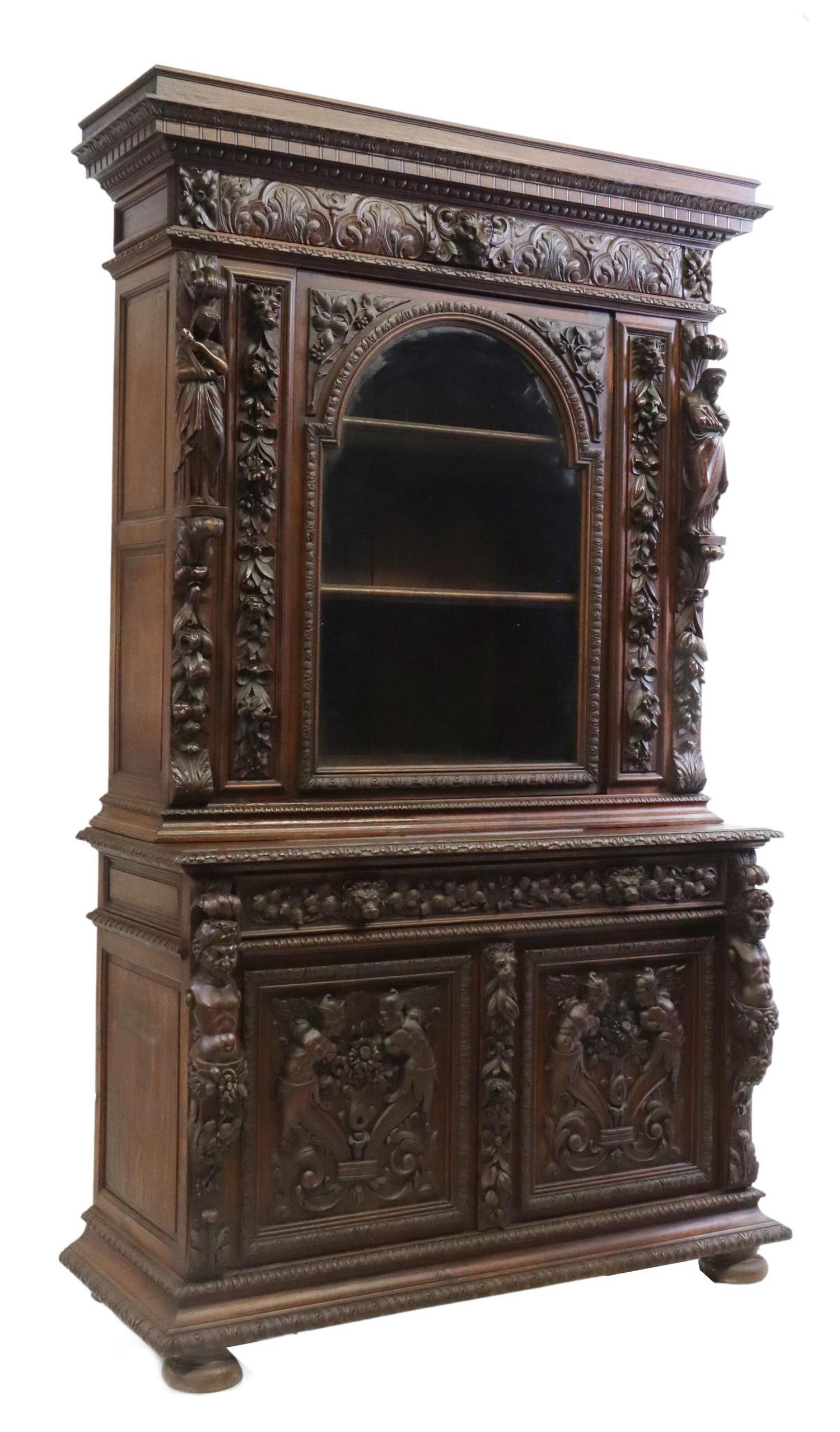 FRENCH HENRI II STYLE FIGURAL CARVED OAK SIDEBOARD: French Henri II style oak sideboard, 19th c., the whole with carved foliates throughout, having molded cornice, over central glazed door, opening to shelved interior, flanked by female Allegories, sin