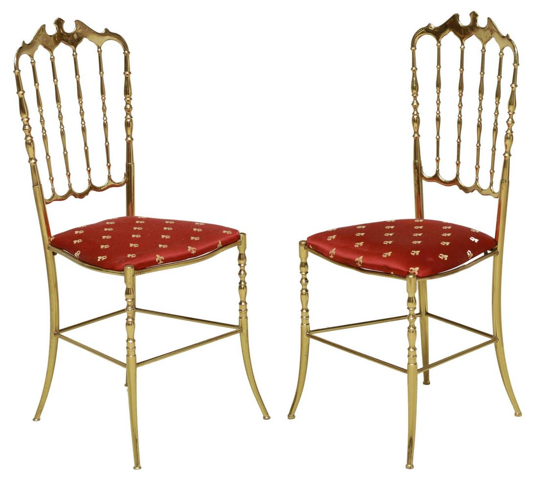 (2) ITALIAN CHIAVARI STYLE BRASS-TONE SIDE CHAIRS: (pair) Italian Chiavari style brass-tone side chairs, 20th c., having spindled back, over seat with fleur-de-lis patterned upholstery, rising on splayed legs, joined with box stretcher, approx 36.5"h,