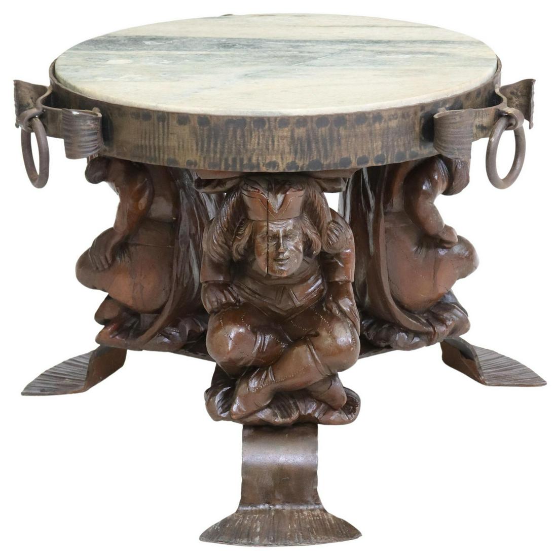 FRENCH MARBLE-TOP IRON FIGURAL TABLE: French marble-top gueridon, 20th c., having circular marble top set in iron framework, above three seated figural supports, each intact with splits, ending in tripodal metal feet, approx 21.25"h, 24" 