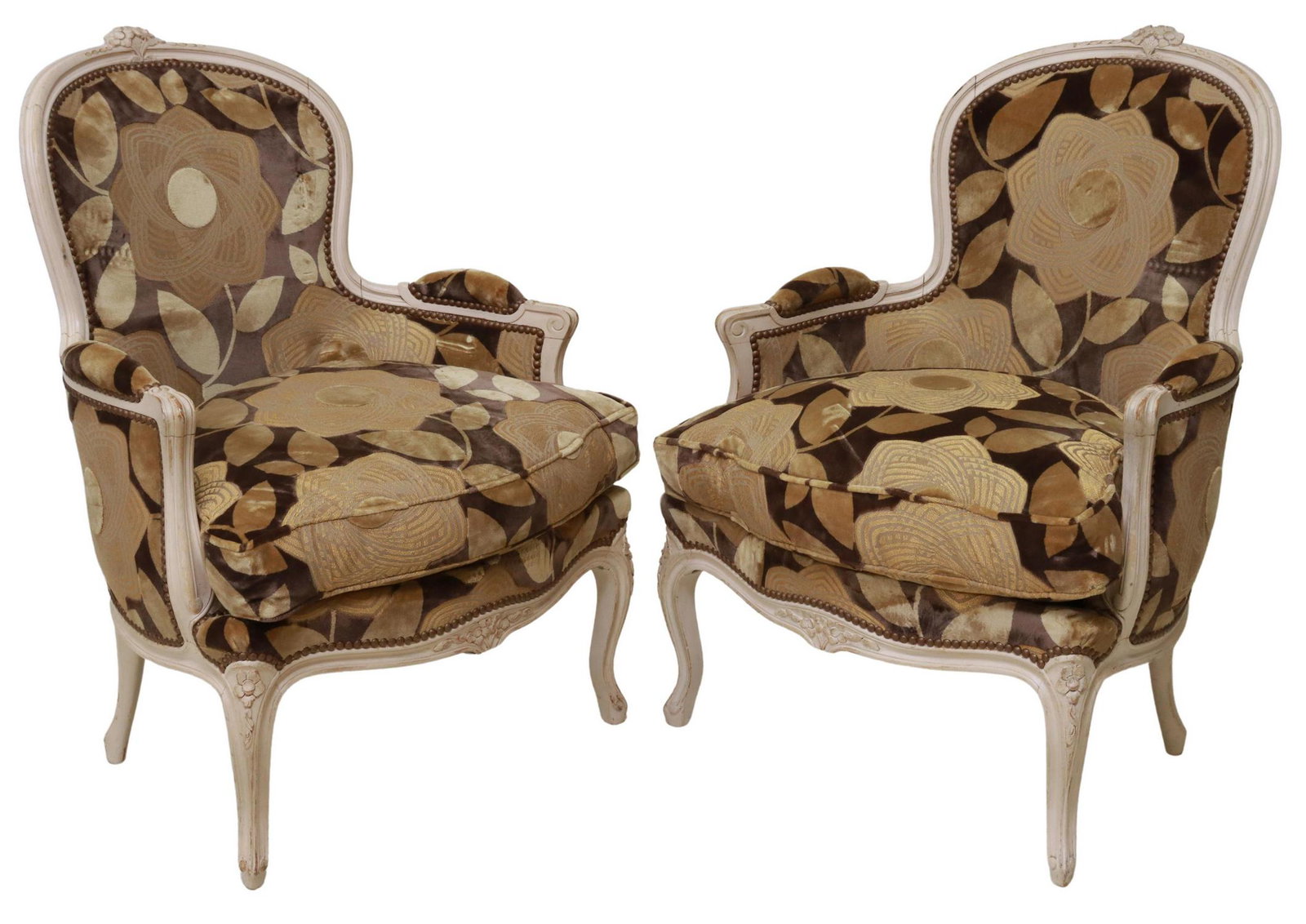 (2) FRENCH LOUIS XV STYLE UPHOLSTERED BERGERES: (pair) French Louis XV style paint-decorated armchairs, 20th c., having floral crest, in a patterned upholstery, with nailhead trim, scrolled handholds, rising on cabriole legs, ending on whorl feet, 