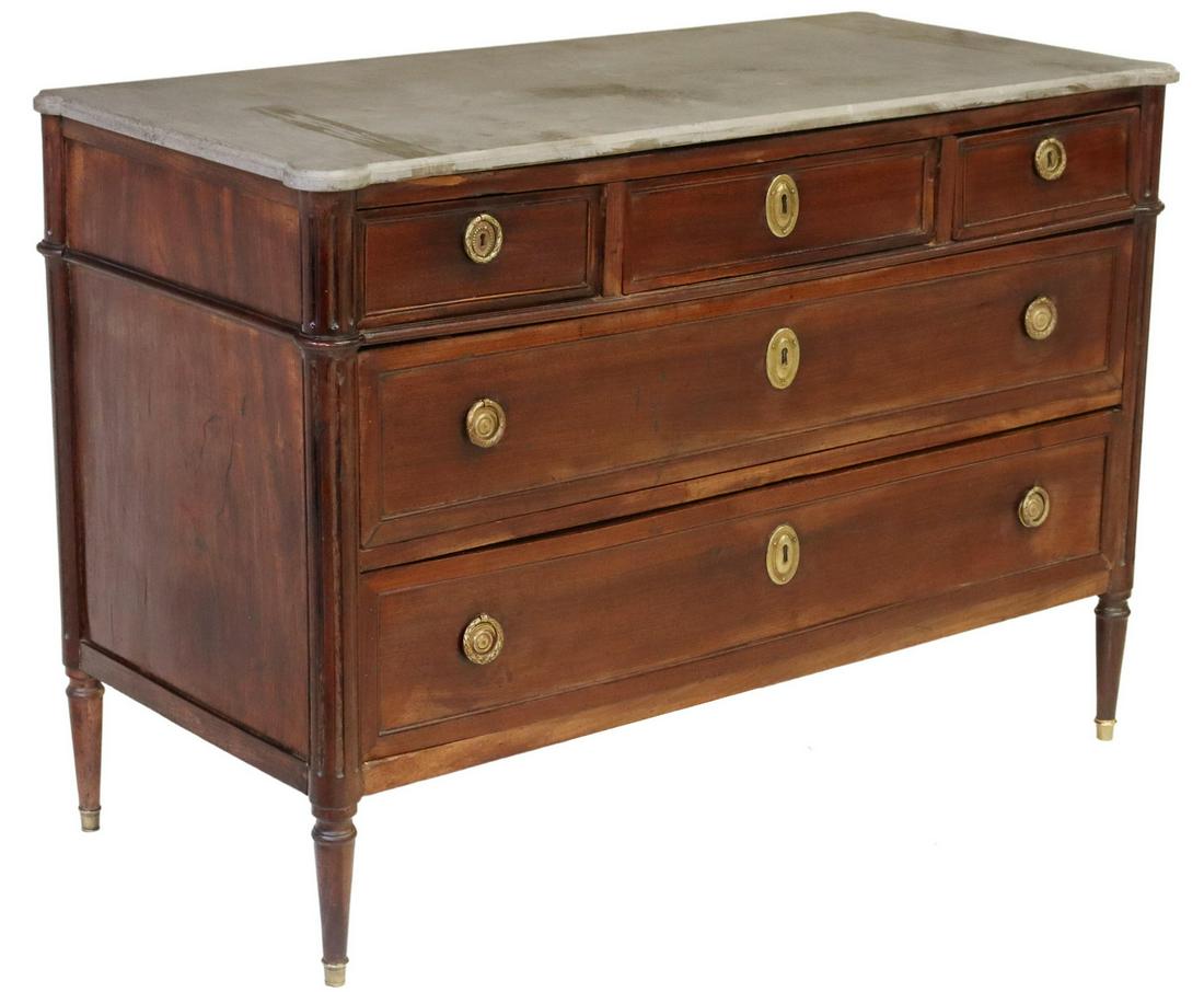 FRENCH LOUIS XVI STYLE MAHOGANY STONE-TOP COMMODE: French Louis XVI style mahogany commode, late 19th/ early 20th c., having stone top, three top drawers, over two full length drawers, flanked by fluted side supports, rising on tapered legs, ending on