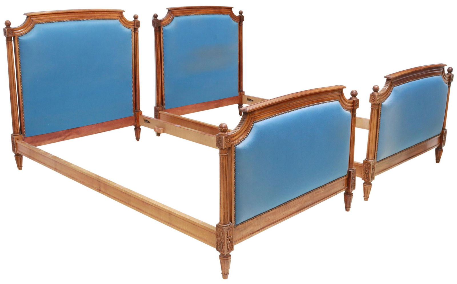 (2) FRENCH LOUIS XVI STYLE UPHOLSTERED BEDS: (pair) French Louis XVI style beds, 20th c., upholstered headboard and footboard, rising on tapering fluted legs, exterior: approx 44"h, 83.5"l, 43.25"w, interior: approx 79"l, 40.25"w Start Price: $2