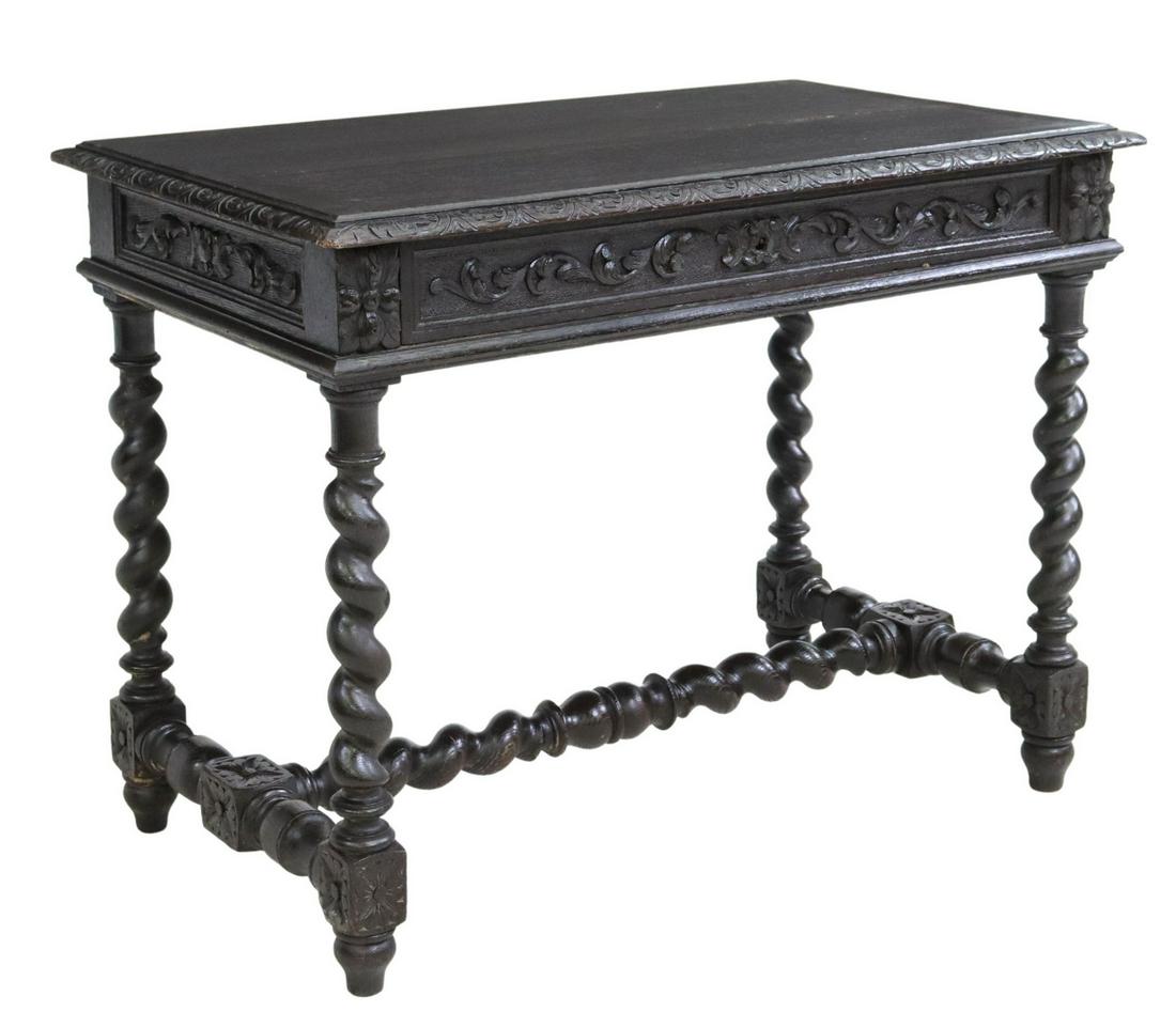 FRENCH LOUIS XIII STYLE EBONIZED OAK WRITING TABLE: French Louis XIII style ebonized oak writing table, 19th c., having carved lunette border, single foliate drawer, rising on twist stretcher-joined legs, ending on turned feet, approx 30"h, 39"w, 23.25