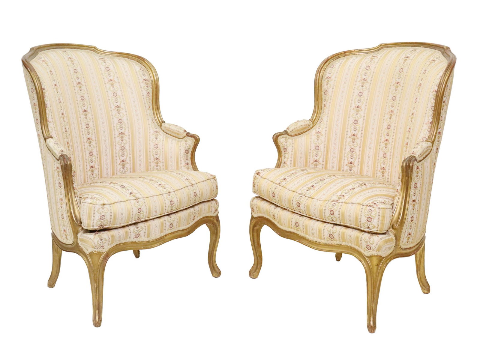 (2) LOUIS XV STYLE UPHOLSTERED GILTWOOD BERGERES: (pair) Louis XV style giltwood armchairs, early 20th c., lisere style upholstery, loose seat cushion, rising on cabriole legs, label for Batts Upholstery, San Antonio, Texas, approx 40.5"h, 29.25"w, 2