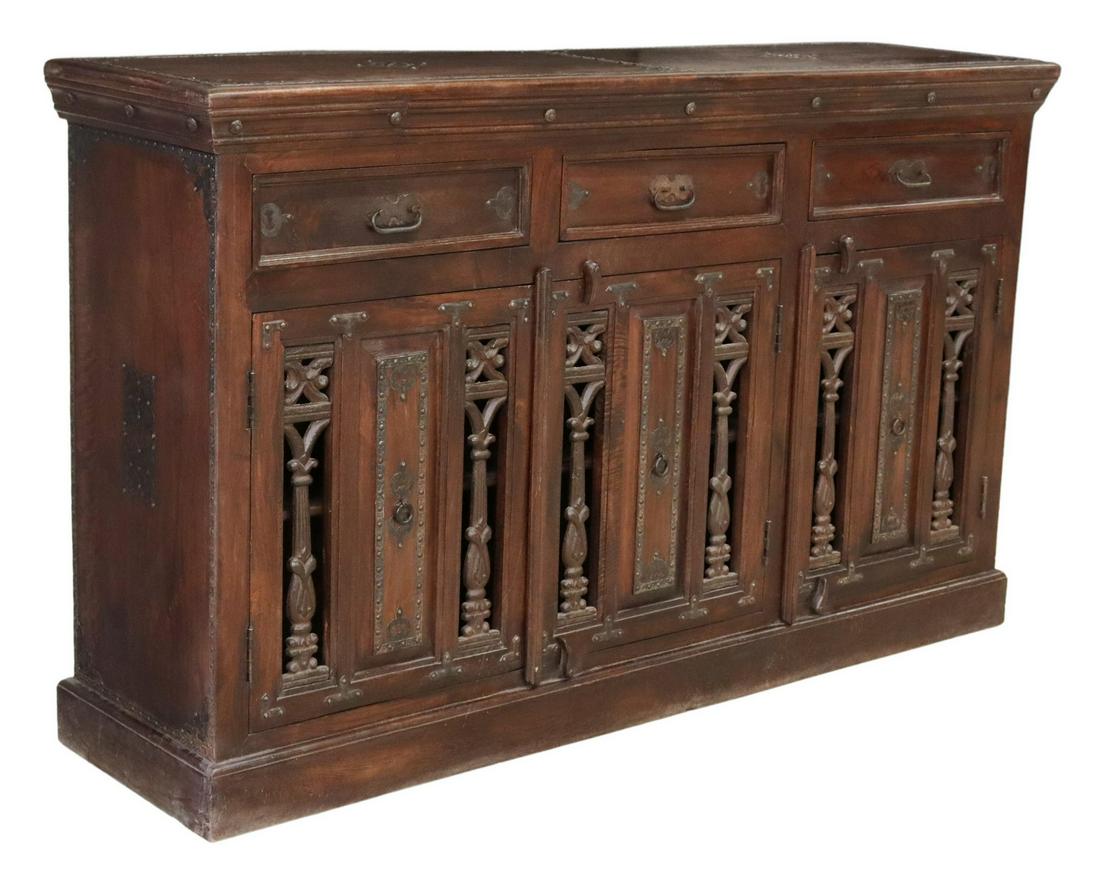 IRON-MOUNTED HARDWOOD SIDEBOARD, INDIA: Metal-mounted hardwood sideboard, India, late 20th c., with iron trim, three drawers, over three doors with cast iron mounts, interior shelves, rising on a plinth base, cord management holes drilled i