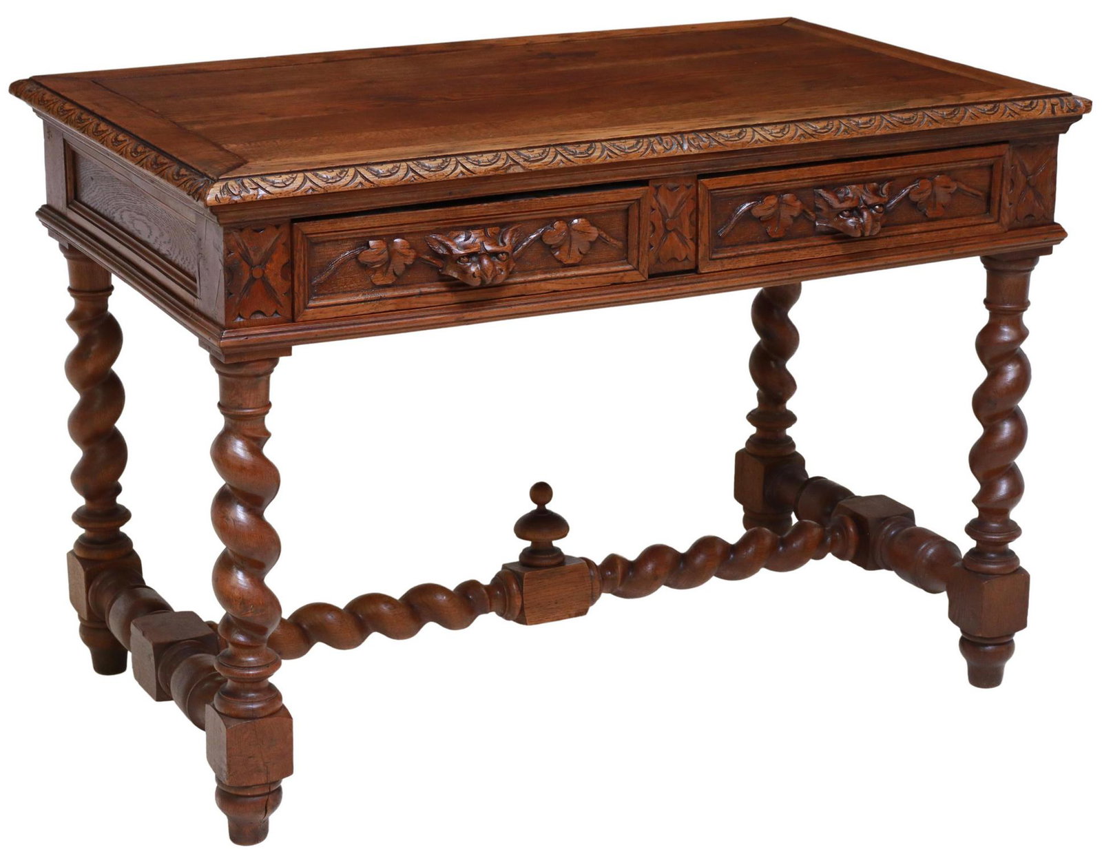 FRENCH LOUIS XIII STYLE CARVED OAK WRITING TABLE: French Louis XIII style oak writing table, late 19th c., two frieze drawers with carved pulls, rising on twist legs, joined by turned stretcher, approx 29.75"h, 43.25"w, 25.5"d Start Price: $150.00