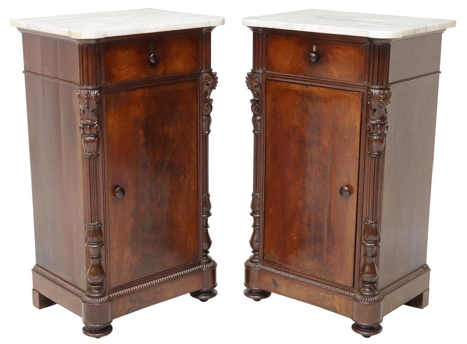(2) ITALIAN MARBLE-TOP MAHOGANY BEDSIDE CABINETS: (pair) Italian mahogany bedside cabinets, 19th c., having marble tops, fitted with one drawer, over one cabinet, opening to shelved interior, flanked by fluted and foliate carved side supports, rising