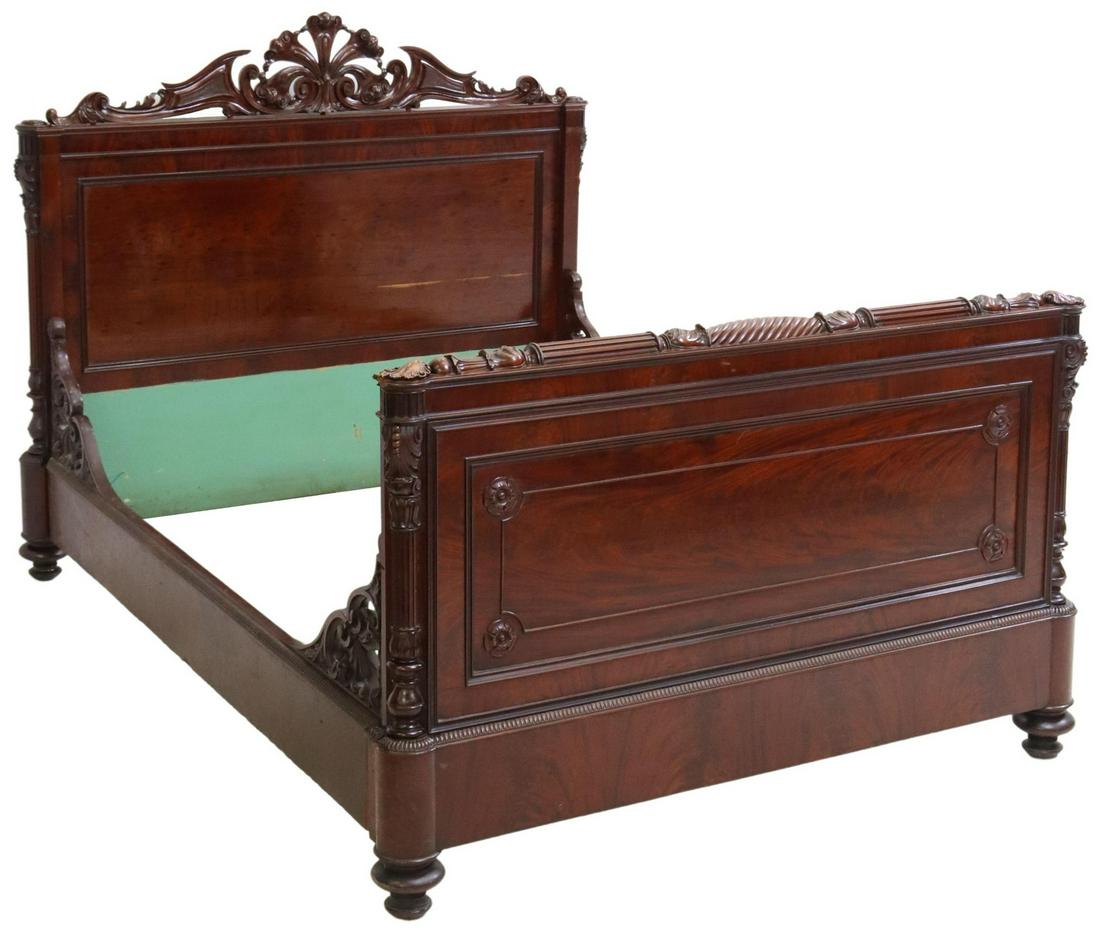 CONTINENTAL CARVED MAHOGANY BED, 19TH C.: Continental mahogany bed, 19th c., carved scrolling crest, headboard and footboard with fluted pilasters, rising on turned feet, restorations to corner brackets on side rails, losses to carving at one