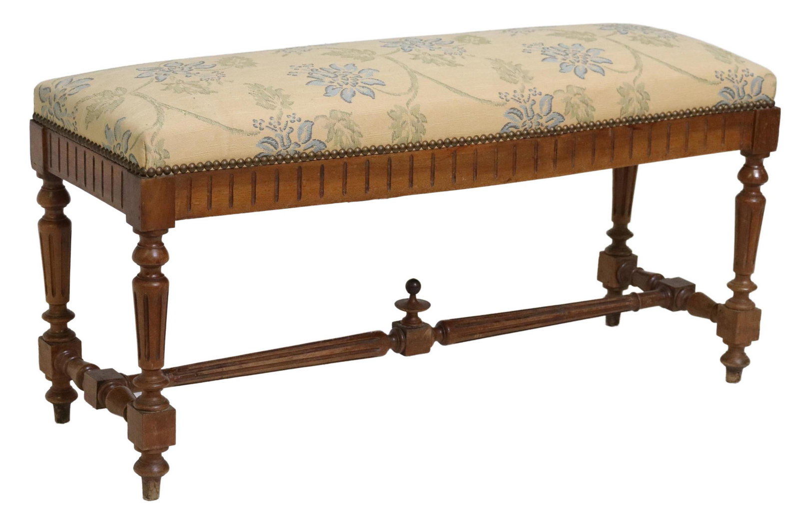 FRENCH LOUIS XVI STYLE UPHOLSTERED BENCH SEAT: French Louis XVI style bench seat, 20th c., seat in a floral upholstery, with nailhead trim, rising on turned and fluted legs, joined with cross stretcher, ending on onion feet, approx 19.75"h, 39.75"