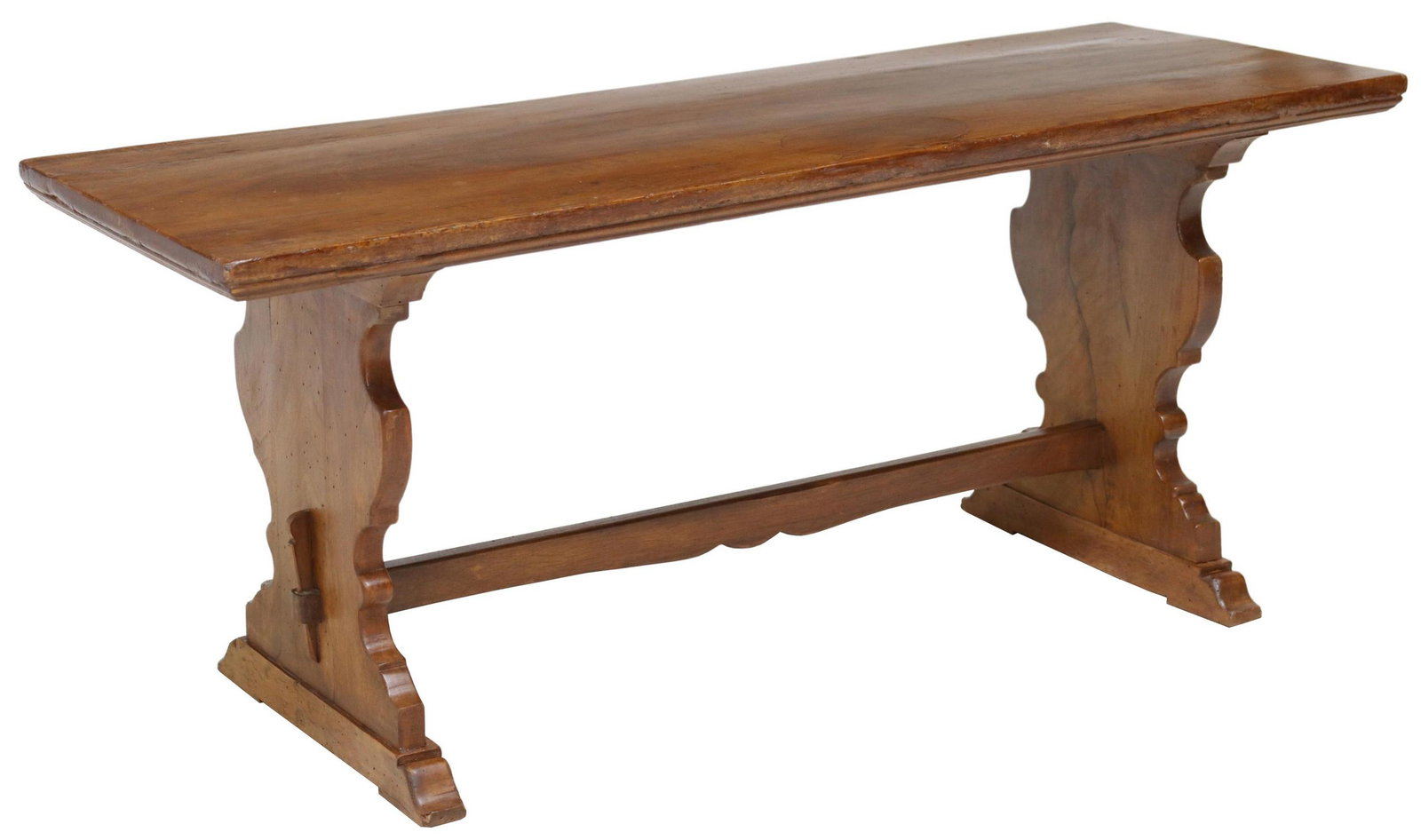 ITALIAN WALNUT TRESTLE COFFEE TABLE, 20"H: Italian walnut trestle coffee table, 19th c., having rectangular top, rising on shaped supports, joined with mortise and tenon joined stretcher, ending on bridge feet, patch repair to top, approx 20"h
