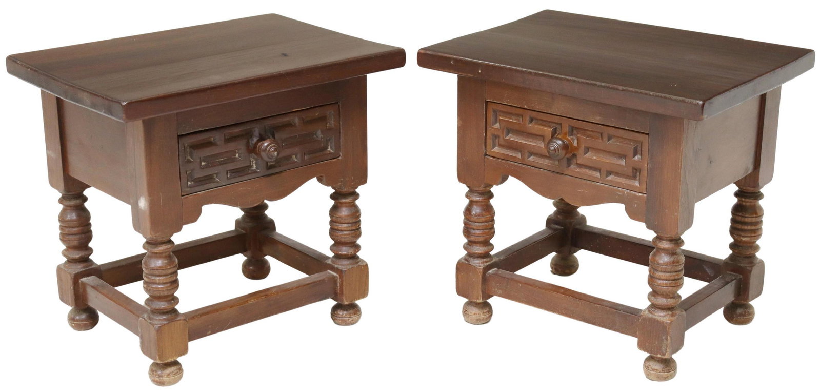 (2) SPANISH BAROQUE STYLE CARVED SIDE TABLES: (pair) Spanish Baroque style nightstands/ side tables, 20th c., rectangular top, over geometric carved drawer, rising on turned legs, joined with box stretcher, ending on bun feet, approx 18.5"h, 19.7