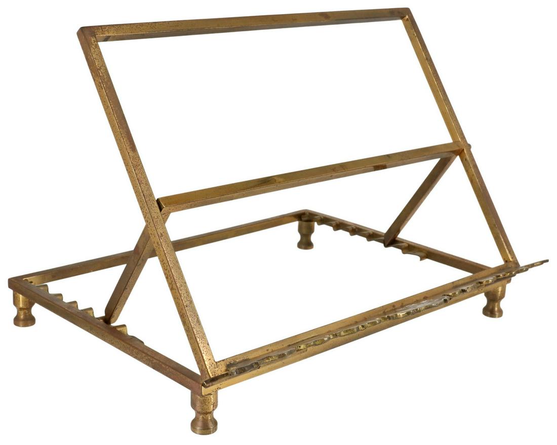CONTINENTAL BRASS MISSAL BOOKSTAND: Continental brass missal bookstand, 20th c., adjustable easel back, book ledge with Chi-Rho/ Christogram symbol, supported by dolphins, rising on turned feet, tallest setting: approx 9.25"h, 12"w, 10.