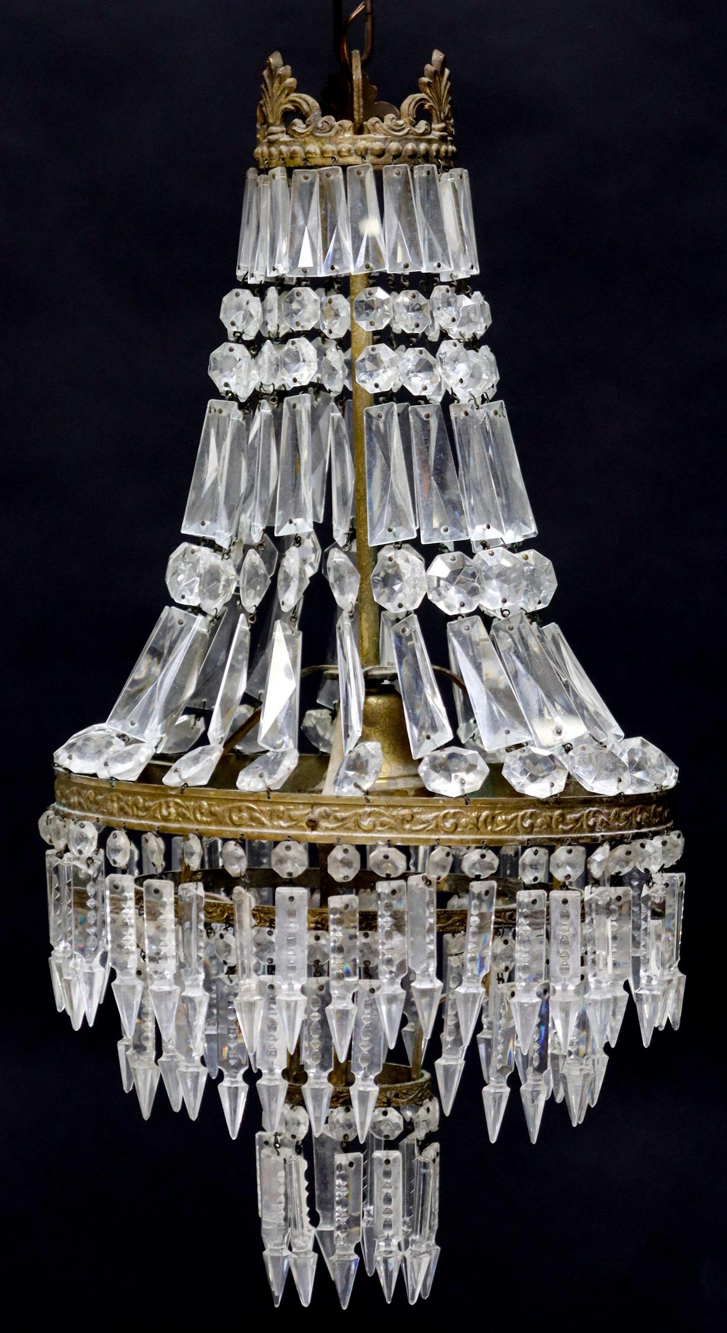 EMPIRE STYLE SAC-A-PEARL SINGLE LIGHT CHANDELIER: Empire style sac-a-pearl single light chandelier, 20th c., having palmette crest, over crystals, three lower tiers of hanging prisms, in need of wiring, approx 23.5"h, 12.25"diam Start Price: $100.00