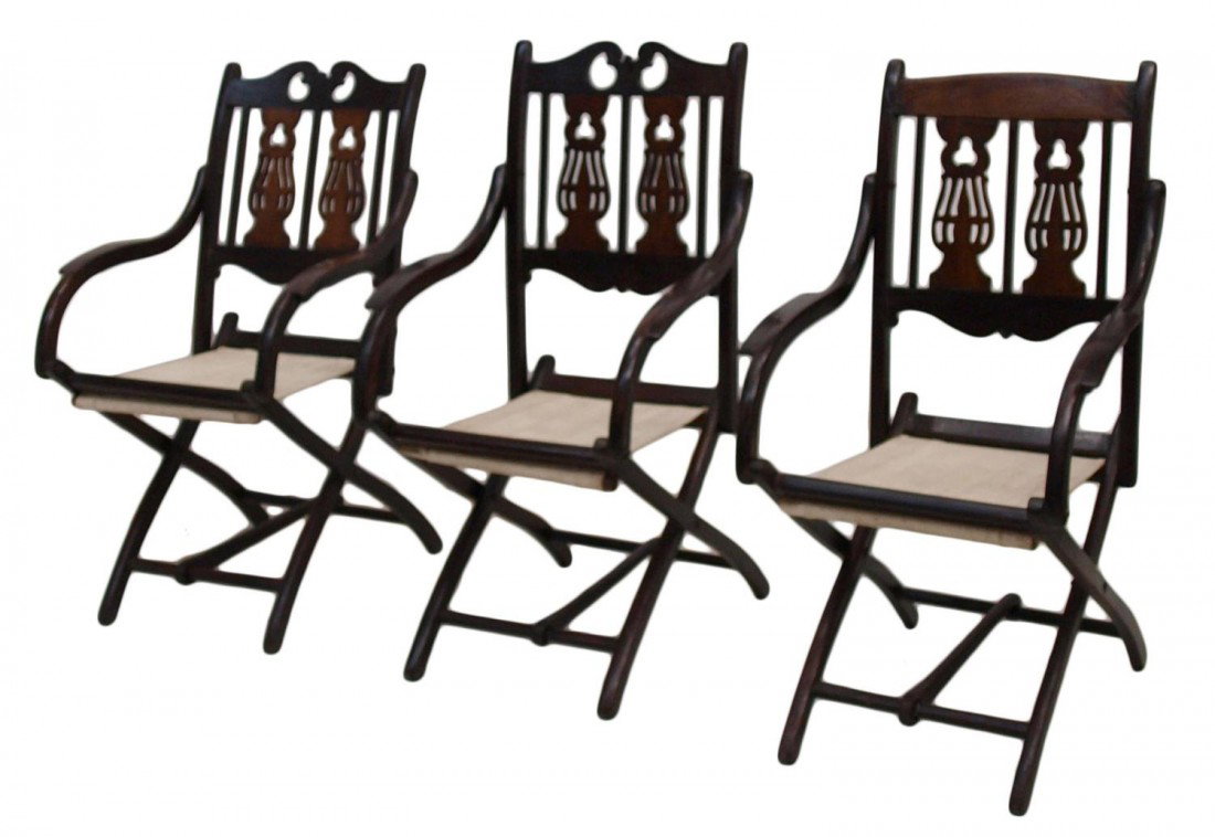 (3) BRITISH COLONIAL FOLDING CAMPAIGN CHAIRS: (lot of 3) British Colonial folding campaign chairs, 19th c, each adjustable chair similarly carved with later canvas, refinished,one with later crest rail, open: 37.25"h, 19.75"w, 24"d, closed: 30.25