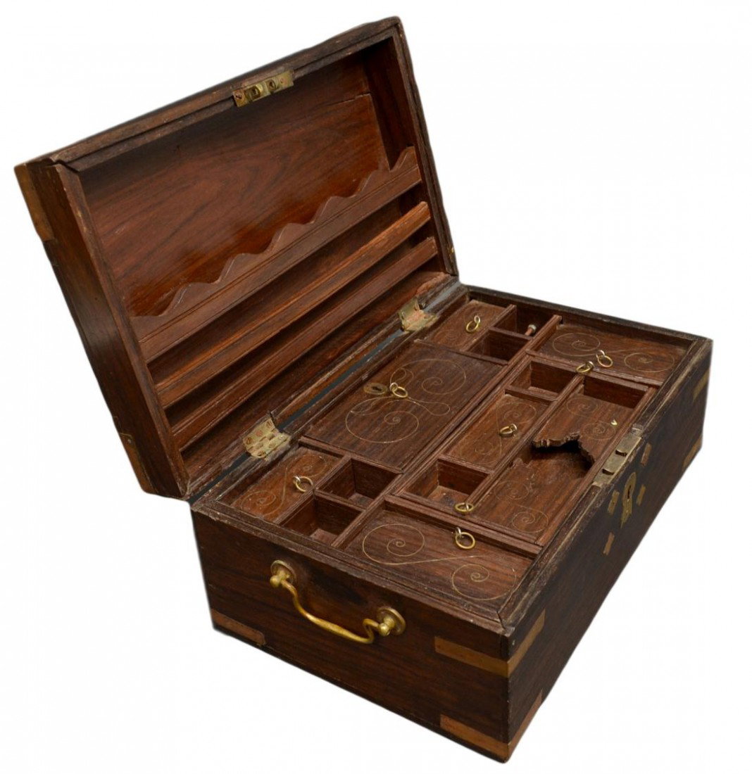 BRITISH COLONIAL ROSEWOOD TRAVEL BOX: British Colonial rosewood campaign box, 19th c., of rectangular form with copper corners, bone inlay at top, side brass carry handles, interior storage slots, lift out tray, hidden storage, letter rac
