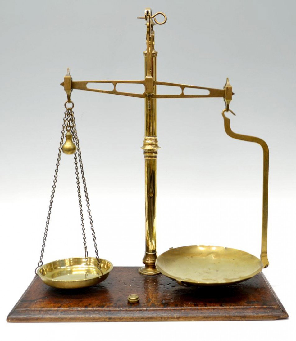 ANTIQUE ENGLISH BRASS BALANCE SCALES: English brass balance scale set on oak base, H. Pooley & Son Ltd., Birmingham, class B, hanging scale pans and weights, (1) weight marked Sovereign, wear/loss consistent with age, 22.75"h, 7.5lbs tota