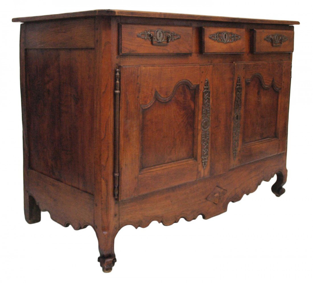 ANTIQUE FRENCH SIDEBOARD, 18TH C.: French Country oak sideboard, c. 1780, a rectangular top placed over three drawers and two doors, shaped skirt, chamfered back boards, rising on short scroll front feet, block rear feet, wood loss, re