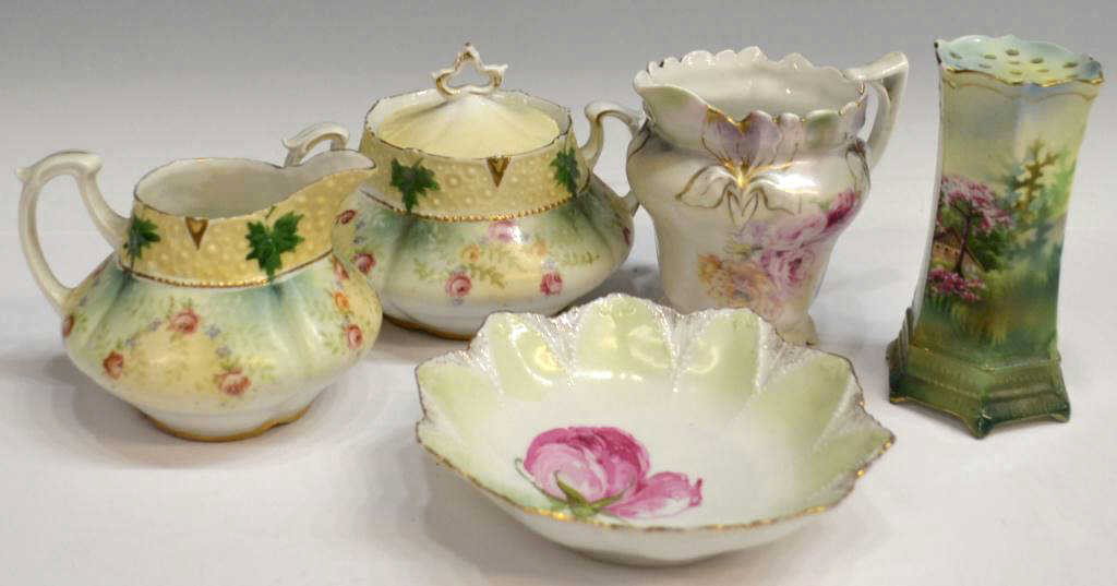 SMALL OFFERING OF RS PRUSSIA PORCELAIN TABLEWARE: ( lot of 5) Collection of assorted hand painted and transfer decorated R.S. Prussia porcelain tableware, various floral designs and gilt detail, all marked underfoot including (1) shaker, (1) small be