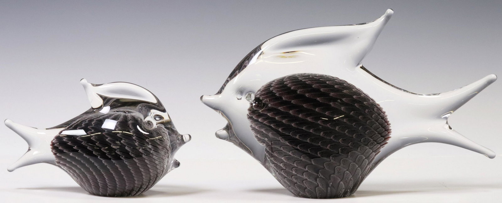 (2) SWEDISH F.M. RONNEBY KONSTGLAS FISH SCULPTURES: (lot of 2) Swedish art glass fish sculptures, F.M. Ronneby, largest: approx 7"h, 11"l, 2.5"w; 7.25lbs total Start Price: $50.00