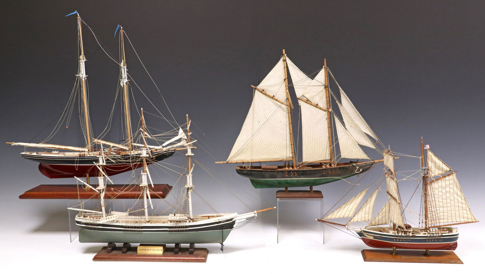 (4) AMERICAN & CANADIAN MERCHANT SHIP MODELS: (lot of 4) Model ships, all on wood plinth bases, including: (1) American clipper ship, "Sovereign of the Seas," built in Boston, 1853, approx 15"h, 21"w, 3.25"d; (1) American fishing schooner, "Gertr