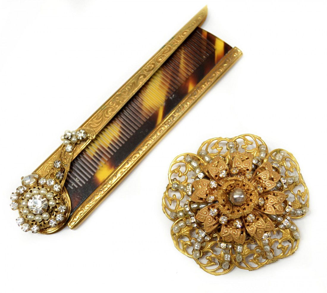 VINTAGE MIRIAM HASKELL BROOCH & FAUX TORTOISE COMB: (lot of 2) A large vintage Miriam Haskell faux pearl brooch, the domed gilt metal frame also mounted with rhinestones, signed in oval, 2"w; together with a faux tortoise shell folding comb, engraved g