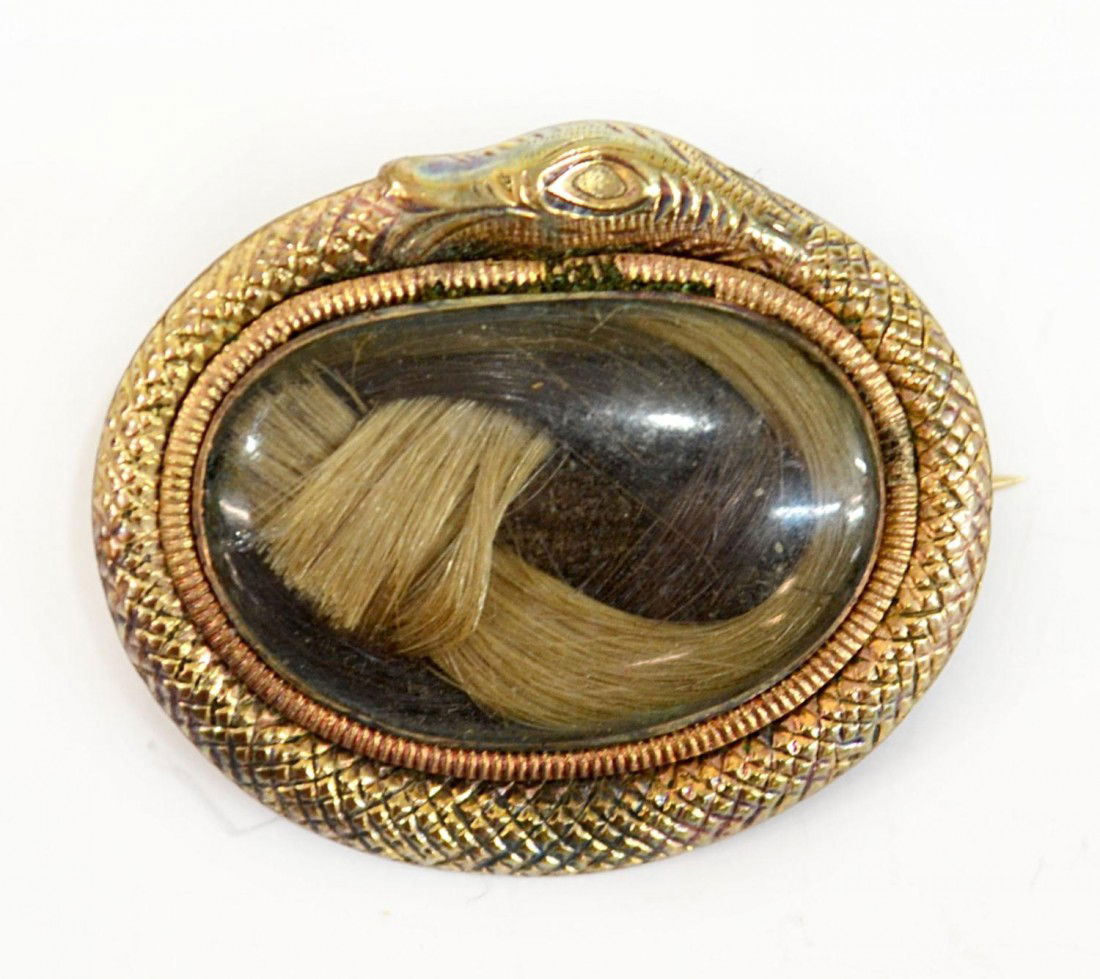 VICTORIAN 9KT GOLD SERPENT HAIR LOCKET / BROOCH: Victorian hair brooch, the 9kt gold surround in the form a serpent biting his own tail, the Ouroboros, signifying eternity, domed glass hair case enclosing woven blonde and brown hair, 1"l, 4.06 grams