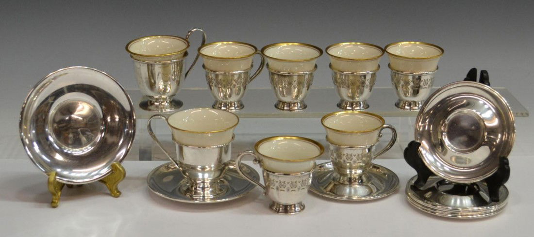 LOT STERLING SILVER & PORCELAIN DEMITASSE CUPS: (lot of 24) Collection of (8) gilt rimmed porcelain demitasse cups fitted in sterling silver frames, with sterling silver underplates, (6) smaller cups with pierced frames accompanied by (6) saucers,