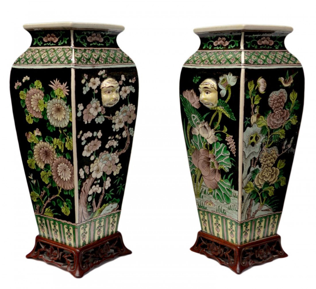 PAIR CHINESE LATE QING DYNASTY FAMILLE NOIR VASES: (pair) Chinese enameled porcelain famille noir vases, late Qing Dynasty, 19th/20th c., decorated with chrysanthemum and lotus flowers on a black ground, applied molded faces on two sides, apocryphal Y
