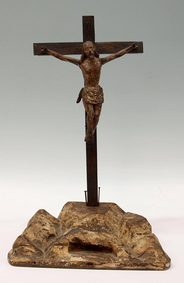 ANTIQUE RELIGIOUS CRUCIFIX, MEXICO, GLASS EYES: Religious Crucifix, Mexico, 19th c., the hand carved Christ figure with glass eyes with remnants of gesso and paint, mounted on a hilly wood tableau, cross likely later, figure: 9.25"h, 8.75"w, cross: