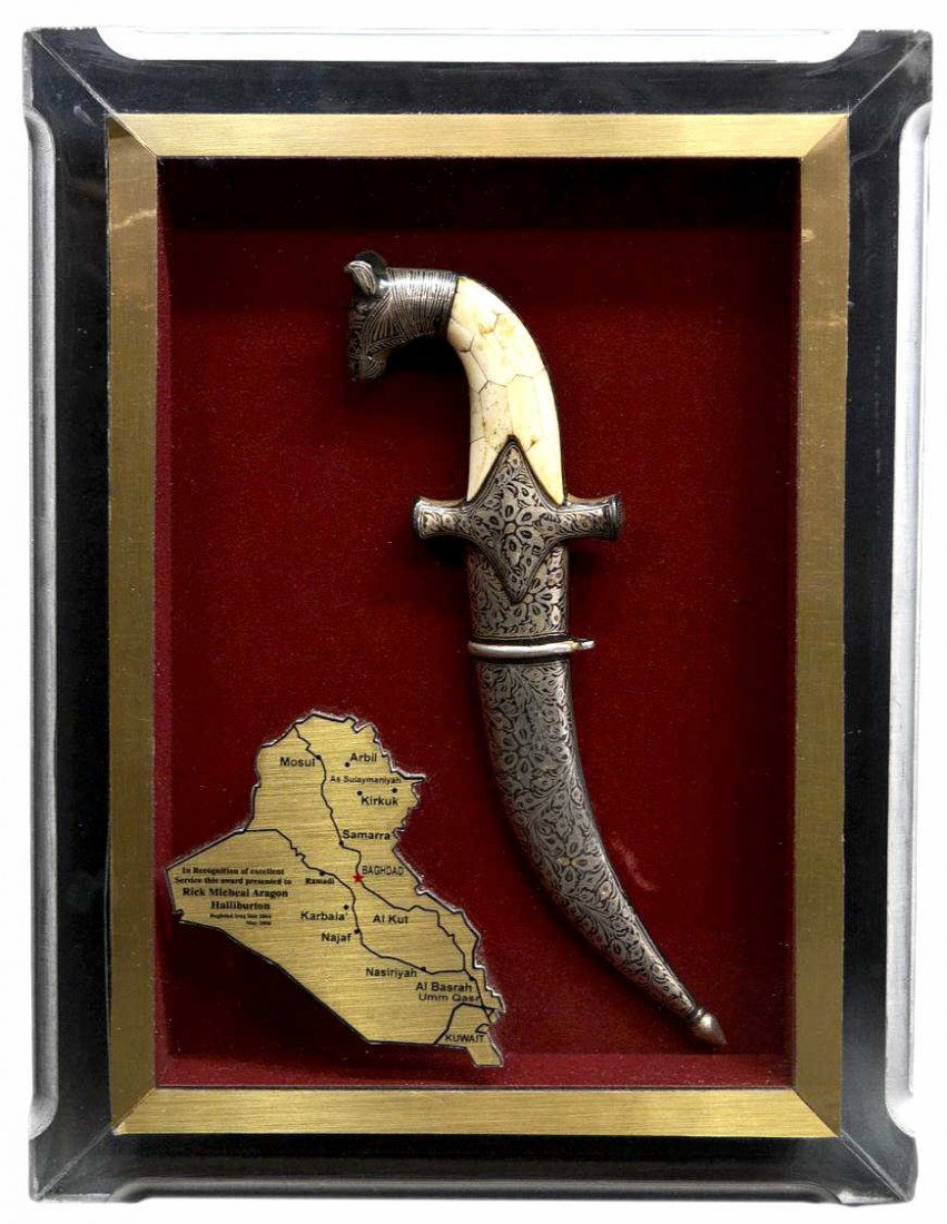 IRAQI PRESENTATION DAMASCUS STEEL DAGGER: (lot of 3) Iraqi items: (1) Framed presentation dagger, Az Zubayr, Al Basrah, Iraq, the ornate 6.5" jambiya knife blade of Damascus steel with an Islamic cartouche at center, the guard decorated in da