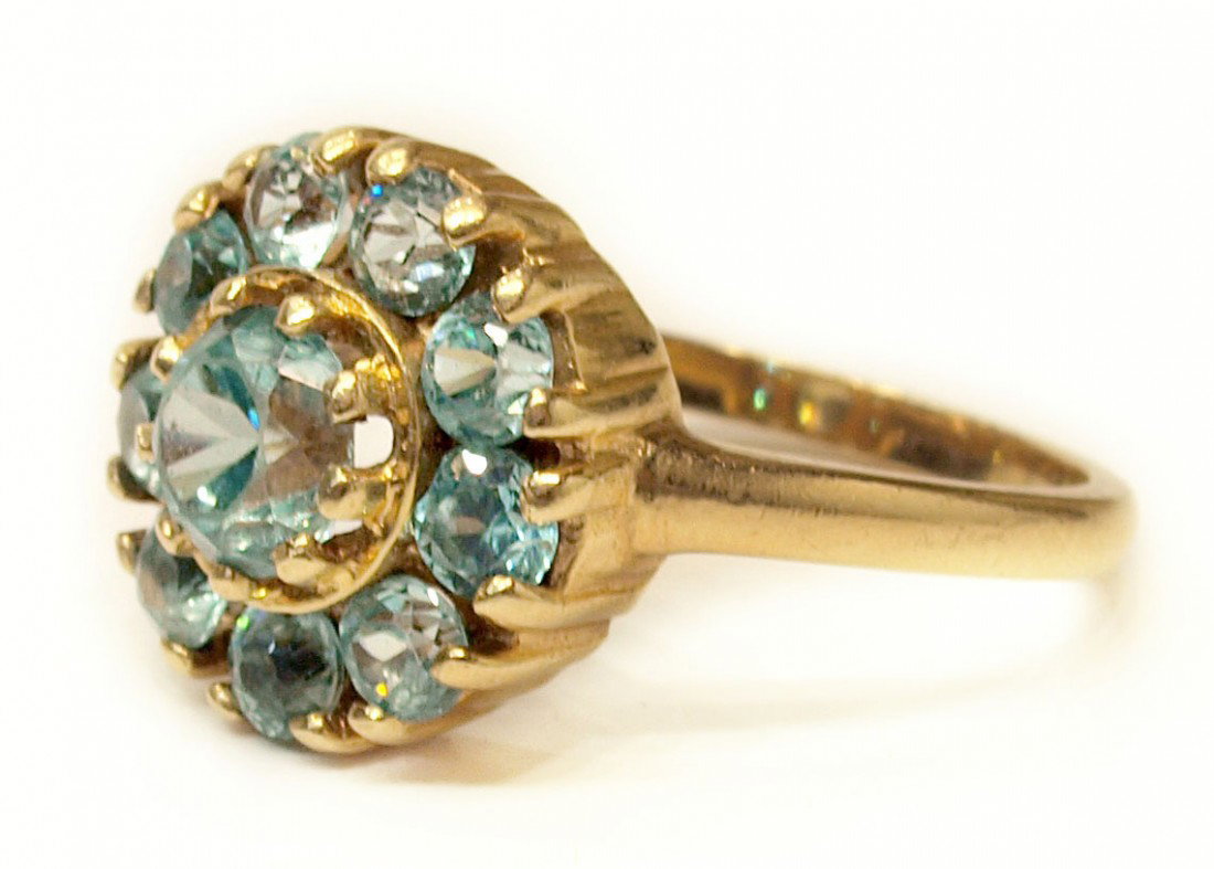 LADIES 14KT GOLD & BLUE ZIRCON RING: Ladies estate ring, the 14kt gold setting set with light blue zircons, slight wear to stones, 4.31 grams (inclusive of stones), size 5.5 Start Price: $50.00