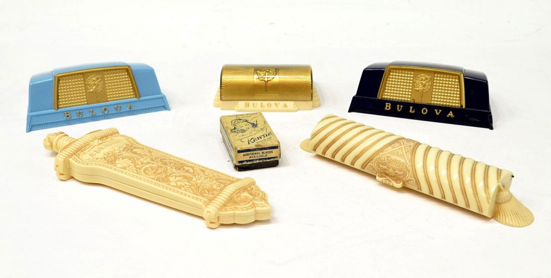 (6) VINTAGE SPEIDEL & BULOVA WATCH CASES & KEWTIE: (lot of 6) Vintage watch and watch band display cases: (1) celluloid Speidel 'Templar' case, ornately formed in the shape of a sword, red liner, 8.75"l; (1) celluloid Speidel 'Golden Harvest' watch ba