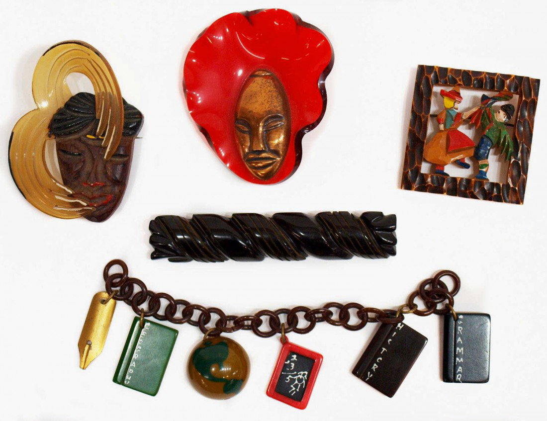 VINTAGE BAKELITE & OTHER FIGURAL BROOCHES & PINS: (lot of 5) Collection of vintage bakelite and other material brooches and bracelet: (1) charm bracelet pertaining to school, charms include books, metal 'pencil', etc. hung from a brown link chain lac