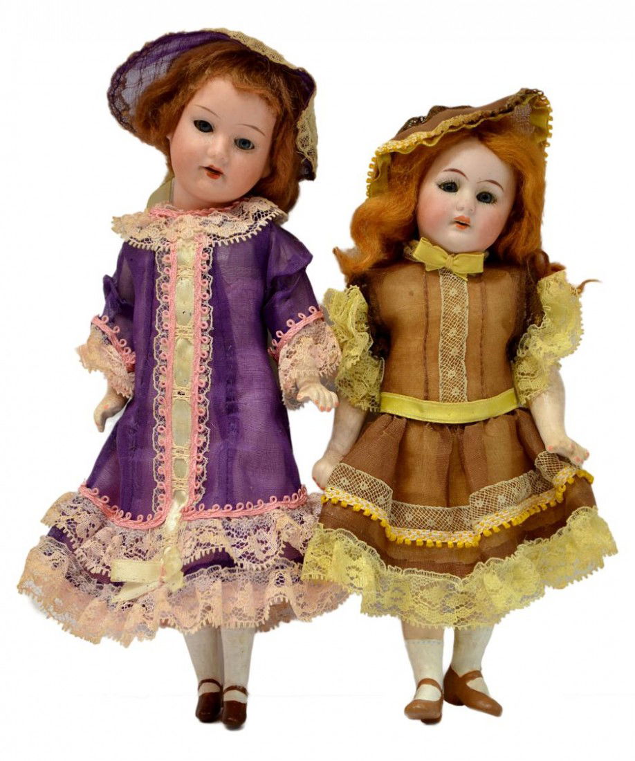(2) ARMAND MARSAILLE & SIMON HALBIG BISQUE DOLLS: (lot of 2) Antique German bisque head dolls: (1) Armand Marseille doll, 11/0, in a purple dress, open mouth, open/close eyes,on a ceramic body, 9"h; (1) Simon & Halbig bisque head doll having painted
