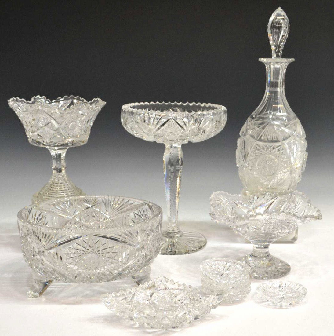 (11) AMERICAN BRILLIANT PERIOD CUT GLASS TABLEWARE: (lot of 11) American Brilliant and cut glass table items including (5) individual salt dishes, (3) compotes, one rising on a stacked stem, the largest on a long notched stem with chip to foot, (1) dec