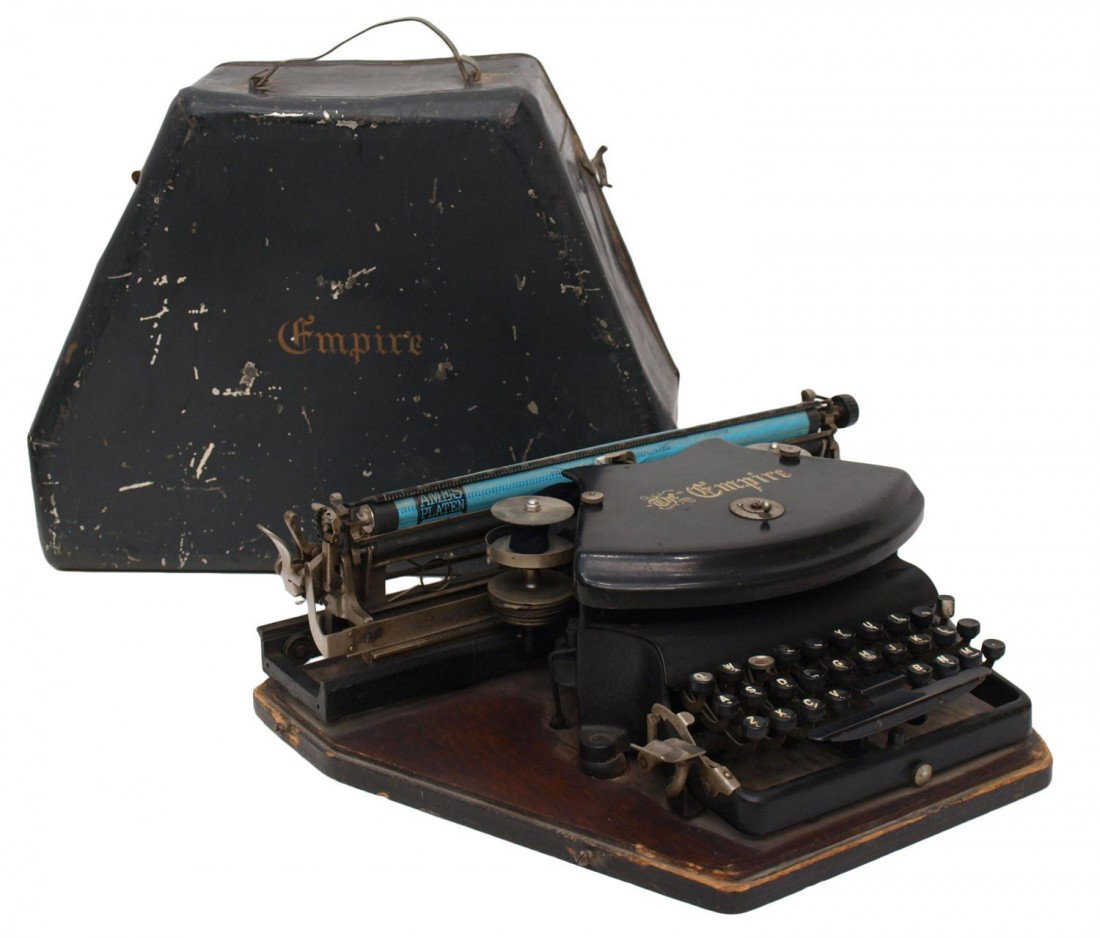 EARLY EMPIRE MODEL 1 TYPEWRITER, C. 1904: Empire thrust action typewriter, Model 1, Williams Manufacturing Company , Montreal , Canada, patent date July 22, 1892, scratched metal cover, the typewriter affixed to an oak base, operates, SN 1352