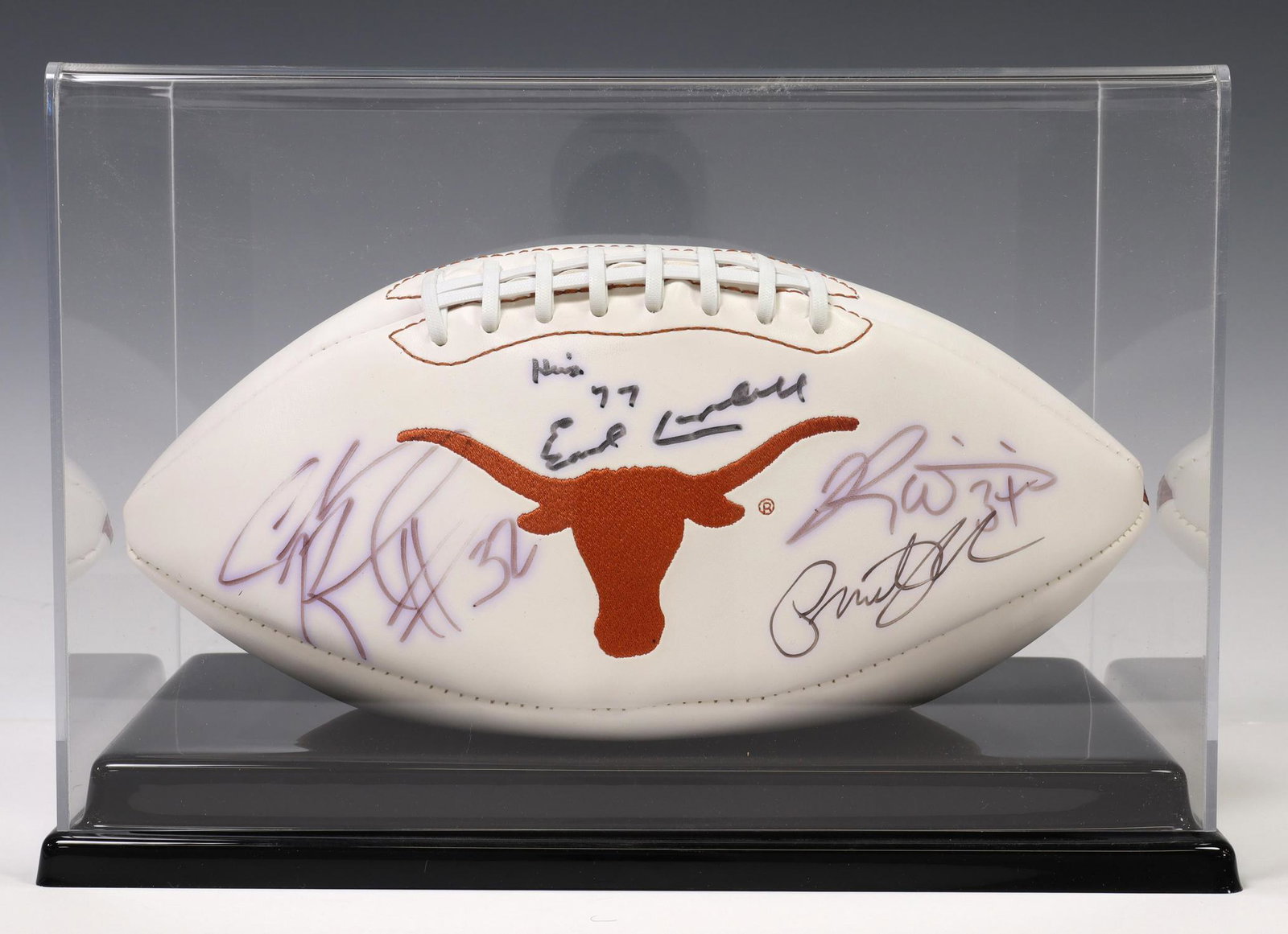 U OF TEXAS FOOTBALL, EARL CAMPBELL, RICK WILLIAMS: University of Texas Longhorn football signed by: Earl Campbell, 1977 Heisman Trophy winner; Ricky Williams, 1998 Heisman Trophy winner; Cedric Benson (1982-2019), #32, All American 2004; one other sig