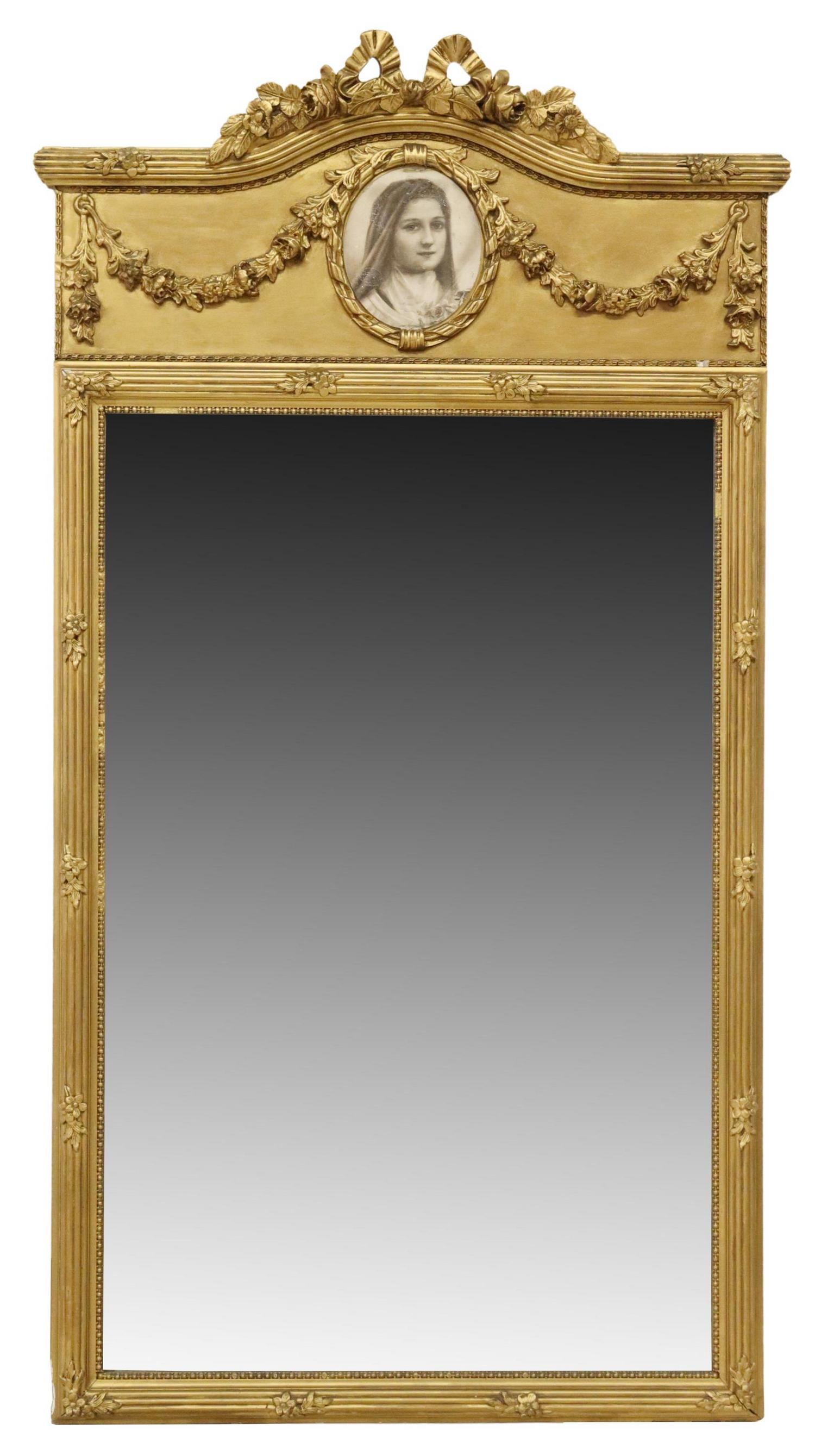 FRENCH LOUIS XVI STYLE GILTWOOD WALL MIRROR: French Louis XVI style giltwood wall mirror, having ribbon and floral crest, over printed portrait medallion, frame encasing beveled mirror plate, some light silver loss, approx 57.5"h, 31.25"w, 30lbs