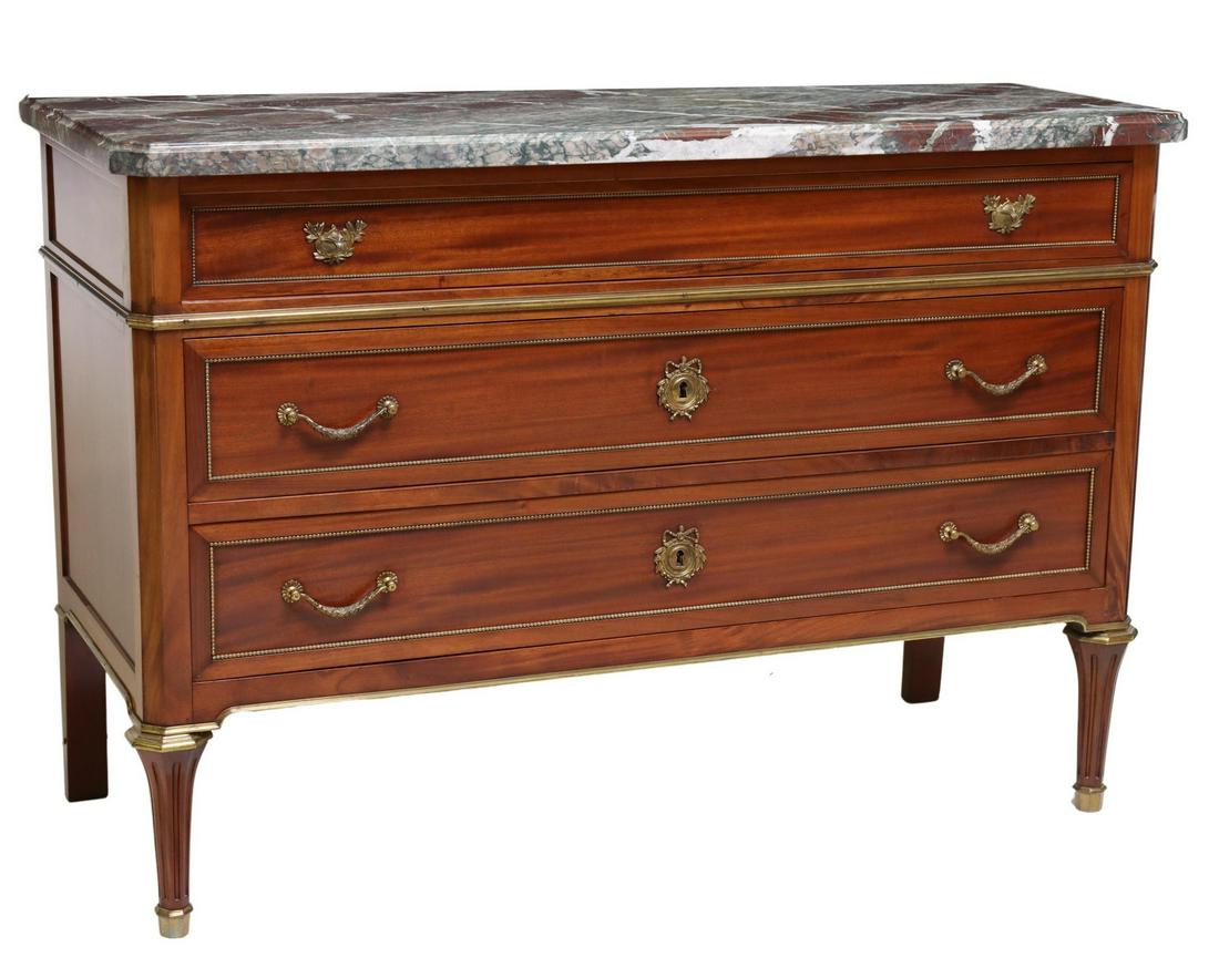 FRENCH LOUIS XVI STYLE MAHOGANY MARBLE-TOP COMMODE: French Louis XVI style mahogany commode, 20th c., having marble top, over three drawers, with beaded trim, rising on front fluted and tapered legs, ending in capped feet, approx 33.75"h, 49.25"w, 20.2