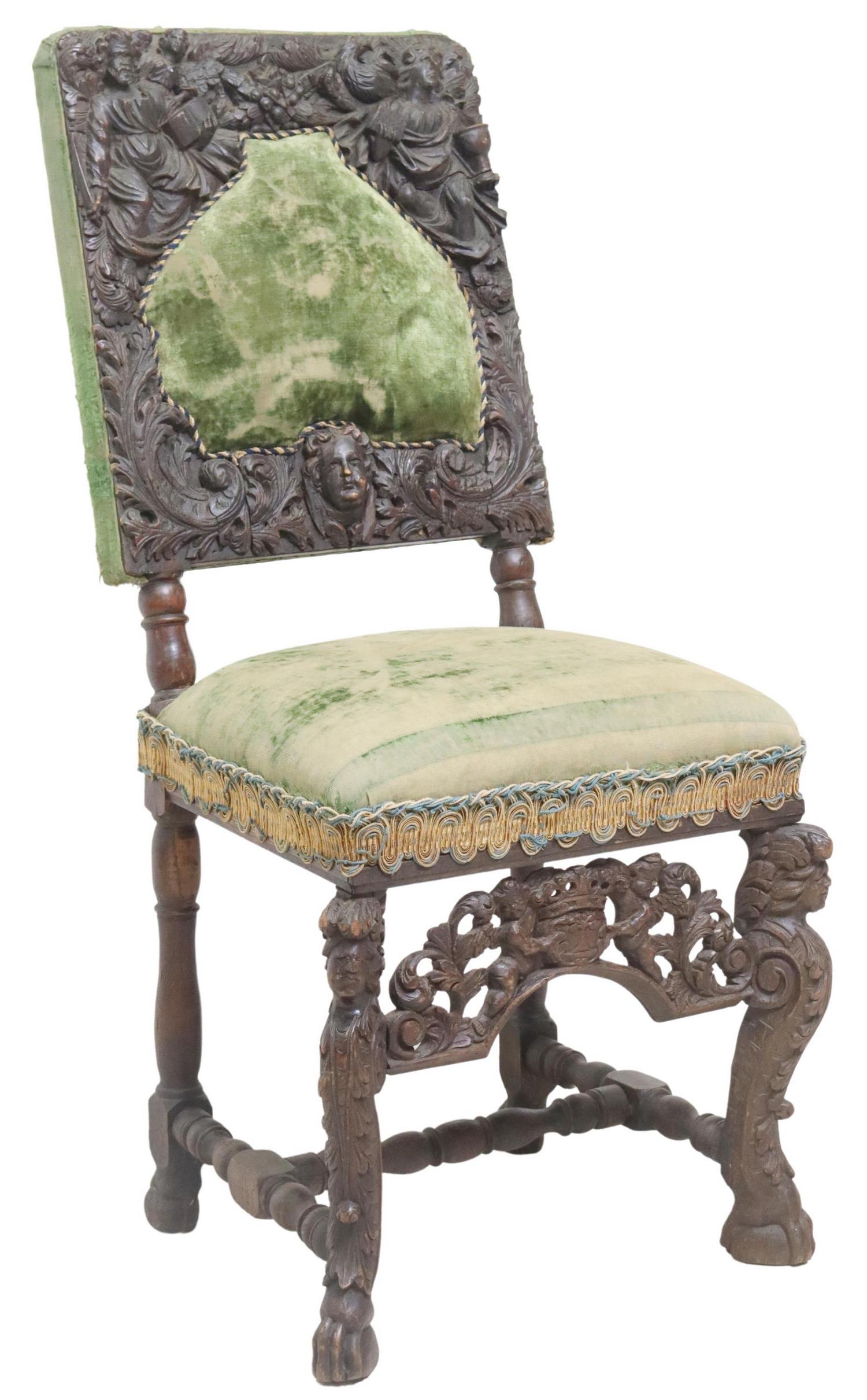 RENAISSANCE REVIVAL FIGURAL CARVED OAK CHAIR: Renaissance Revival carved oak chair, 19th c., heavily carved back with figures and foliates, centering shaped padded back rest, in worn upholstery, over pierced cherub apron, rising on scrolled figur