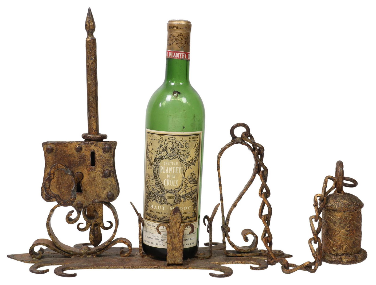 PARCEL GILT WROUGHT IRON ARCHITECTUAL SCULPTURE: Antique wrought iron sculpture, a parcel gilt door lock, in a gilt finish, with fleur-de-lis motifs to top and bottom, over bell-form door knocker on chain, approx 14.75"h, 6.5"w, 13"d, accompanied by